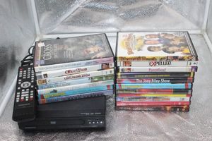 lot 135 image: Magnavox DVD Player with Remote and 19 DVD Movies