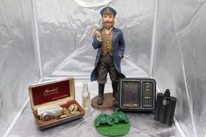lot 136 image: Home Dcor Statute, Vintage Norelco Shaver, Humorous Frogs, Fish ID Eagle and cologne