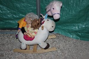 lot 139 image: Toys, Rocking Horse, 2 dolls and horse head on a stick toy