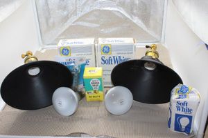 lot 108 image: Two  mounting light fixtures and extra light bulbs