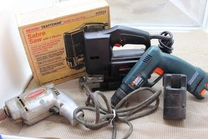 lot 204 image: Power Tools Craftsman Saber saw with Original box, Sunbeam, Vintage corded Drill, and Black and Decker Battery powered Drill (no battery) has charger
