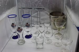 lot 208 image: Under cabinet wine glass rack, Stemware and Bubba shrimp Glasses, Ice Bucket and more
