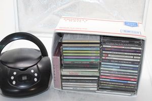 lot 268 image: Box of CDs and Portable CD playerRadio