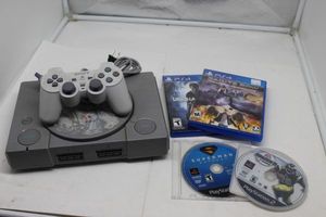 lot 26 image: Sony Playstation, Controller and Games, PS 4 games