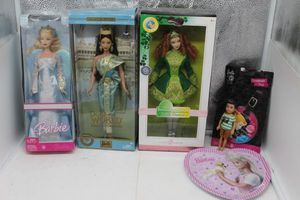 lot 10 image: Barbies Holiday Angel, Dolls of the World Princess of Cambodia, Festivals of the World, Irish Dance, Luggage Tag all unopened, along with little boy and plate