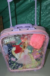 lot 24 image: Barbie Suitcase with Wheels full of Barbie Clothes