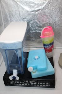 lot 418 image: Zero filtered wather container, ice packs, cup with straw and k cup holder