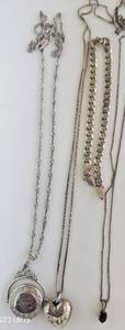 lot 421 image: Jewelery  Silver 3 necklaces & bracelet broken. Beautiful carved heart Pendant,  chain stamped 925 italy, garnett pendant on chain, garnett stamped 925 and chain, stamped 925. Loved locket on chain stamped 925. Bracelet stamped 925 italy broken