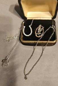 lot 422 image: Jewelry Sterling silver horseshoe necklace stamped 925, bracelet stamped 925 and eagle tie pin stamped 925