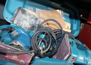 lot 32 image: Two sizes Electric Hand Sanders in Plastic Storage Case