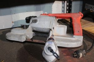 lot 30 image: Milwaukie Heavy Duty Handheld Band Saw and Irwin Chalk line