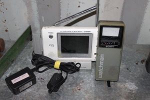 lot 87 image: Portable Axion Color TV w FM Radio and Vintage Sony Watchman TVRadio