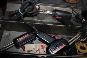 lot 141 image: Three Soldering Guns and more in carry Box