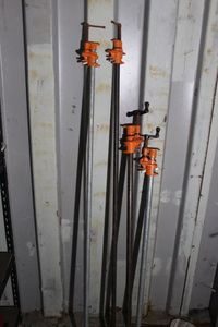 lot 195 image: Four Long Pole Clamps