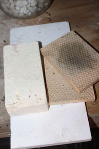 lot 168 image: Two Honeycomb Heat Plates and other Heat Resistant Items