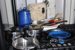 lot 114 image: Outdoor cookware Including Blue Enamel Peculator, Frying pans and more