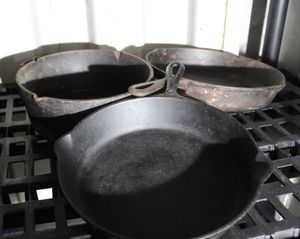lot 117 image: Cast Iron Cookware as shown