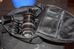 lot 221 image: Three 35 MM Camera Lenses, Pentax Atache, Sears Auto 3X, and Vivitar Skylight,  See Photos, and Camera Backpack