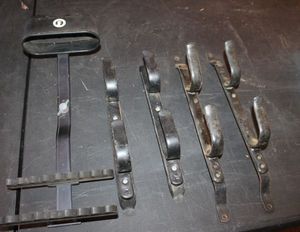 lot 234 image: Two Pair wall Gun Racks as well as Arrow Scabbard
