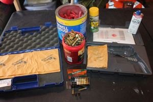 lot 235 image: Some 38 special bullets, Over 150 rounds of 22 Bullets, and 2 empty gun cases