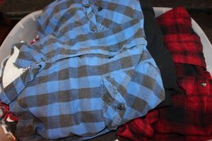 lot 259 image: Tote Of Warm Clothing, Mens and Womens xl-xxl, Includes coats, Plaid lined shirts, Few Robes anad More