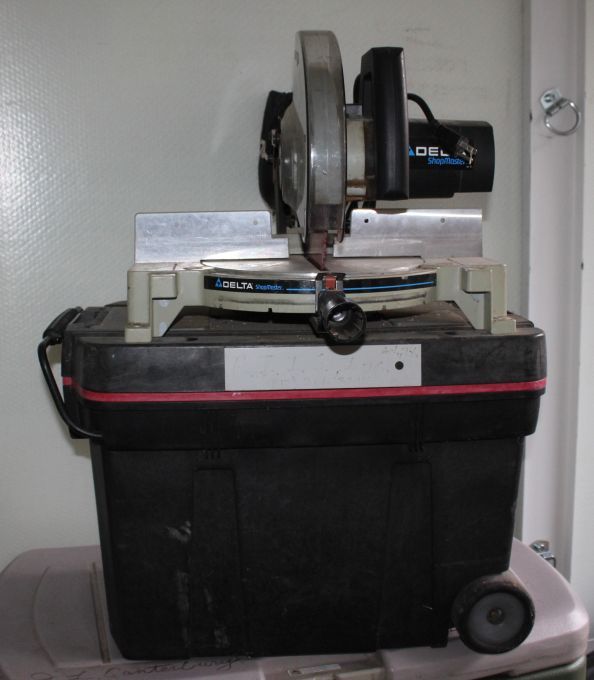 lot 5 image: Delta Shop master miter chop saw mounted onto tote  lid, Contents included