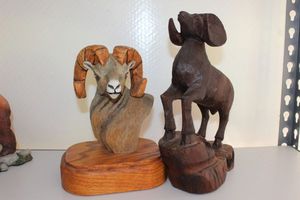 lot 43 image: Hand carved ram head and Ironwood hand carved ram