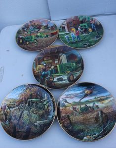 lot 63 image: The Danbury Mint Presents Life on the Farm Collectors John Deer Plates by Charles Freitag