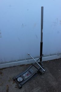 lot 13 image: Three Ton Floor Jack and Tire Iron