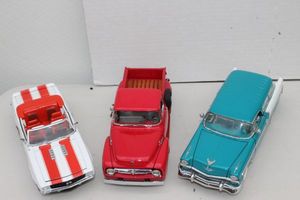 lot 138 image: Franklin Mint 1956 Chevy Nomad, Danbury Mint 1956 Ford F-100 Pickup, and Franklin Mint 1969 Camaro