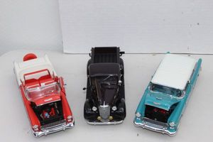 lot 139 image: Danbury Mint 1955 Chevrolet Bel Air Nomad, Danbury Mint 1937 Chevrolet Pickup, and Franklin Mint 1955 Chevrolet Bel Air Red
