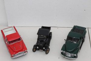 lot 144 image: Danbury Mint 1953 Cheverolet 3100 Pick up, Danbury Mint 1925 Ford Model T, and Danbury Mint 1957 Chevrolet Cameo Pick up