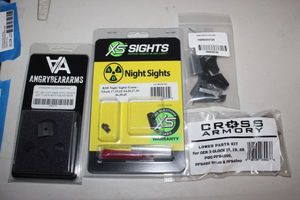 lot 198 image: Gun Parts Cross Armory Lower Parts Kit for Gen 3 Glock, 17,019,026, Xs Sights, Night Sights, Angry Bear Arms Standard Clock Sight Set, and Frame Parts Kit for Glock