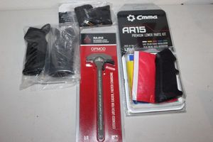 lot 212 image: gun parts AR-15 Bones, Polymer Grip, Sight Mark Laser Scope Sight, AR15 Premium lower Parts Kits, and Badger