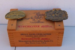 lot 206 image: Winchester Wooden Box and Two Vintage Belt Buckles