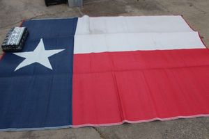 lot 238 image: Texas Flag RV Outdoor Rug and Unopened Black and White RV Rug