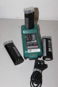 lot 243 image: Three Makita Batteries and Charger