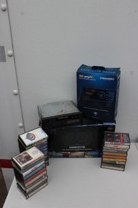lot 249 image: Sirius for Auto System, Car Stereo with Cassette Deck, Auto Speakers and Selection of Cassettes