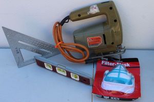 lot 291 image: Black and Decker Jig Saw, Filter Mask, Square and Level.