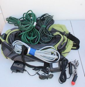 lot 299 image: Three Extension cords, and other plugs, Eddie Bauer Bag