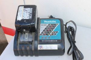 lot 305 image: Makita Charger and Battery