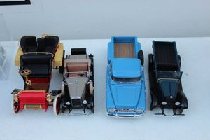 lot 374 image: Four Die Cast Cars Franklin Mint 1903 Ford Model A, Danbury Mint 1931 Ford Model A, Danbury Mint 1058 Chevrolet Apache and Danbury Mint 1931 Chevrolet Roadster Pick up