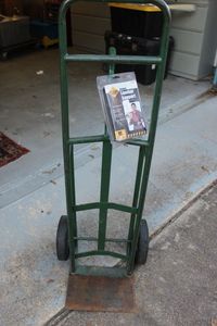 lot 375 image: Two Wheel Dolly and Unused Lumbar Back Support