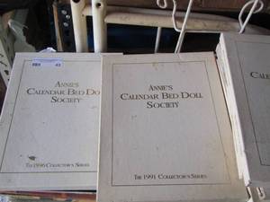 lot 43 image: Annies calendar bed doll society  collector series books