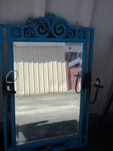 lot 66 image: Turquoise mirror with candle holders on each side