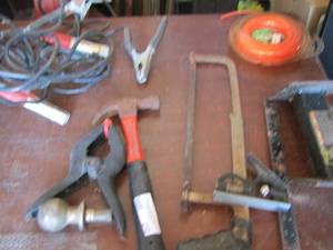 lot 210 image: hammer, plyers, hand saw, weed eater string and more