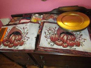 lot 110 image: Thanksgiving placemats, gold charger plates, table cloths