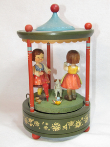 lot 122 image: Thorens Swiss movement Hand-carved Schmid with two little girls dancing with dog music box