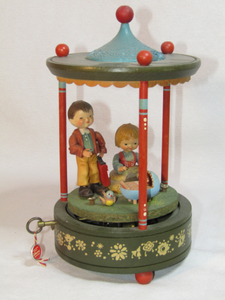 lot 125 image: Thorens Swiss movement Hand-carved Schmid Anri with family music box