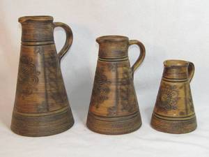 lot 126 image: Handarbeit earthen-ware pitchers Three matching set